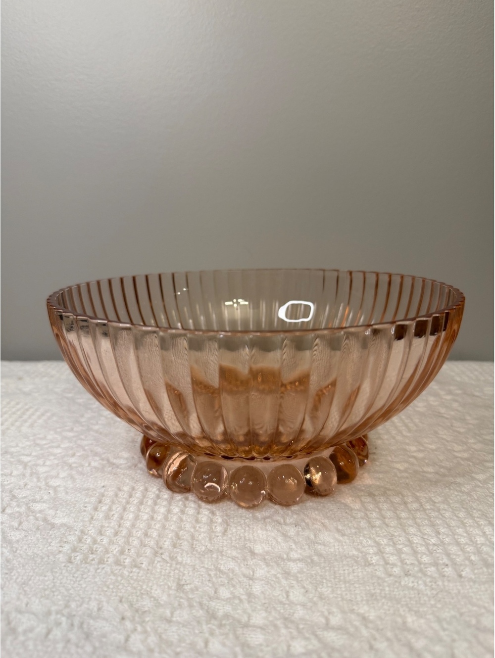Pink depression glass ribbed bowl with bubbled base